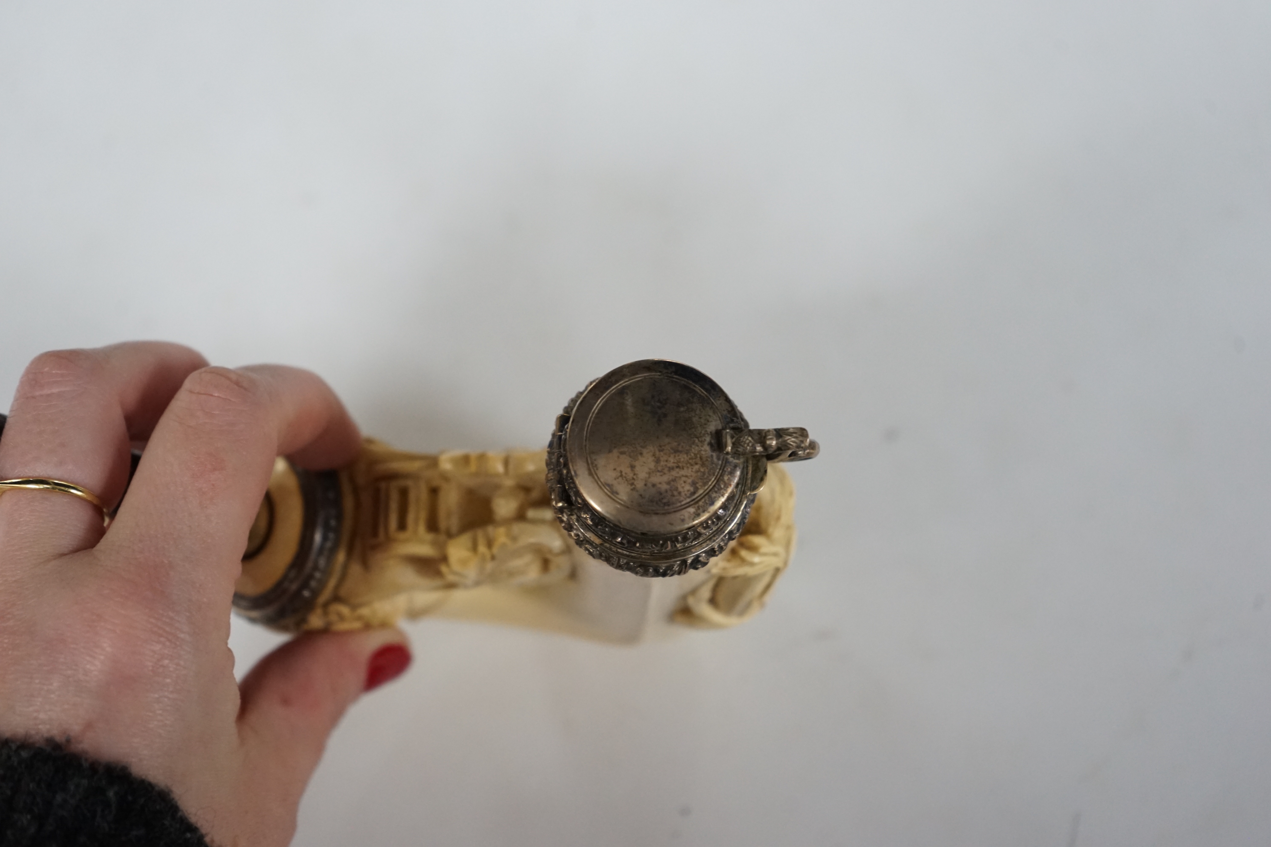 An ornate Meerschaum pipe, with carved monogram on the bowl and metal cover, 30cm long